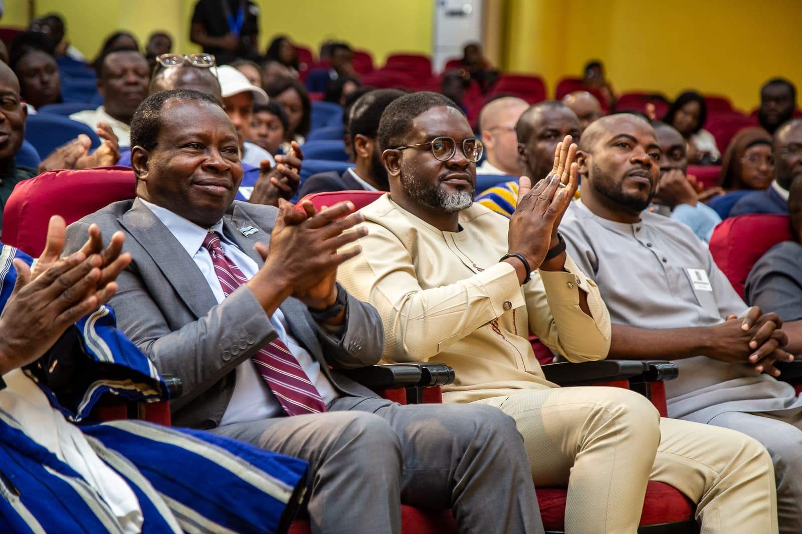 Members and guests applaud during proceedings