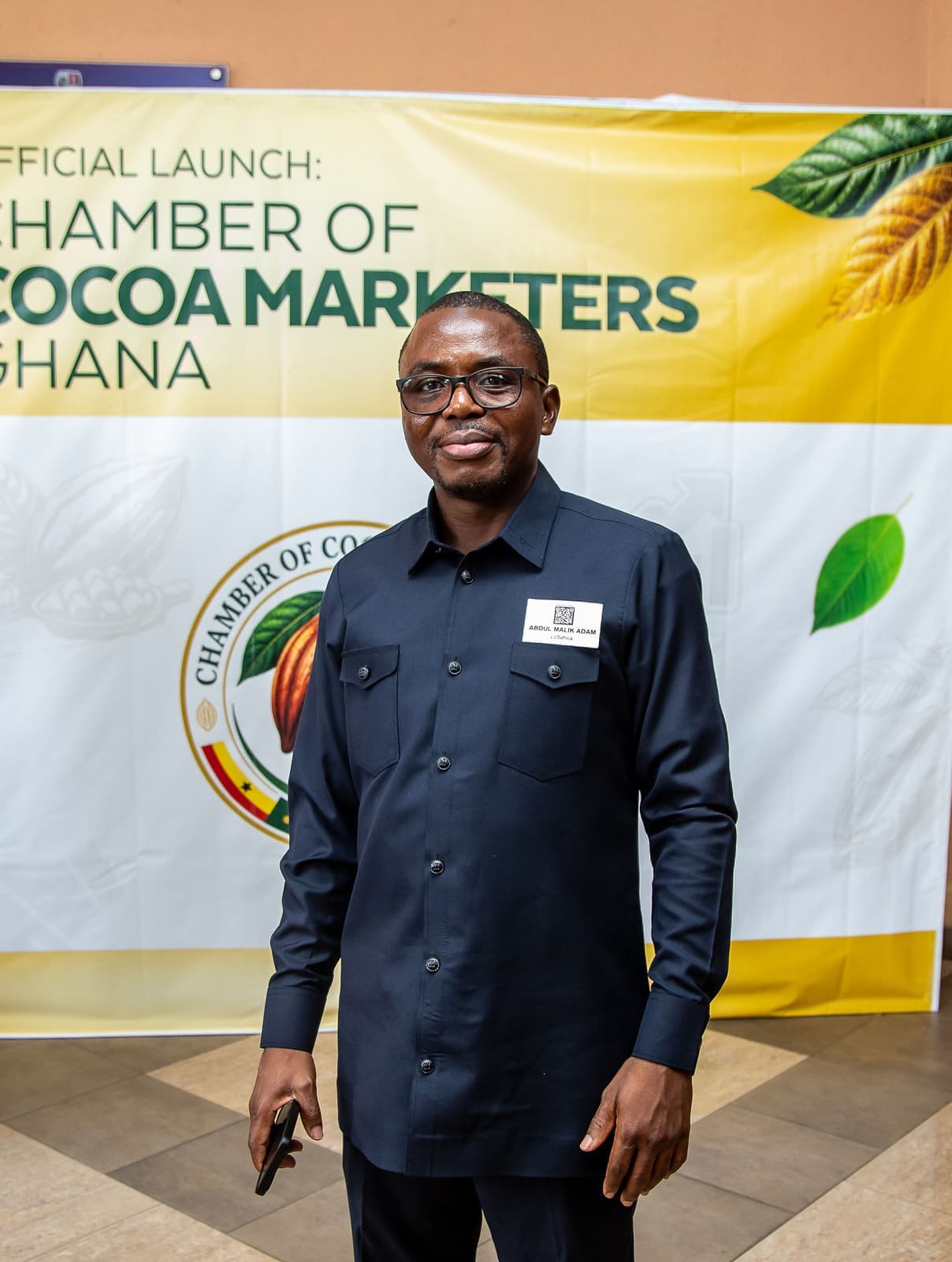 A guest at the launch backdrop